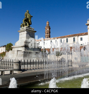 A statue to Gambetta with Gambetta Lycee Tower behind in Cahors, Lot 46, Midi Pyrenees, France, Europe Stock Photo