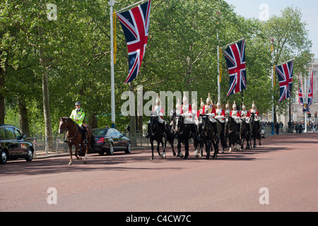 Household cavalry riding down The Mall 2 days prior to the wedding of Prince William and Catherine Middleton. Stock Photo