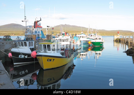 Fishing Boats moored up at Port Askaig Harbour Stock Photo