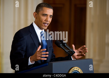 President Barack Obama speaks in the East Room of the White House. Stock Photo