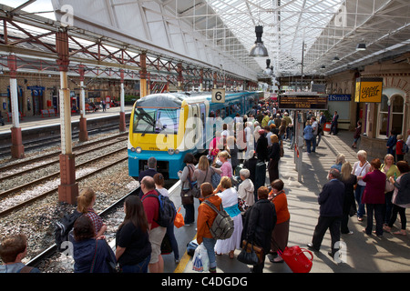 Train arriving at railway station in Crewe, Cheshire, UK Stock Photo