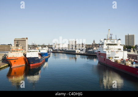 Ships docked in port supplying the rigs for the North Sea offshore oil industry. Aberdeen, Aberdeenshire, Scotland, UK, Britain. Stock Photo