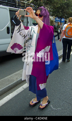 Paris, France, French Demonstration Against Nuclear Power, Japanese Woman in Kimono, taking photos of political protest on Street Stock Photo