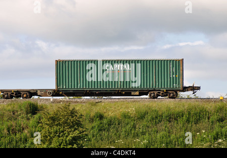 Capital shipping container on train Stock Photo