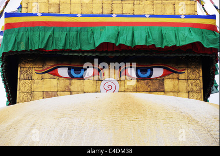 Buddha eyes painted on the base of the golden tower on the Bodhnath Buddhist Temple in Kathmandu, Nepal. Stock Photo