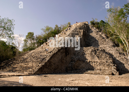 Tourists climbing the Nohoch Mul pyramid at the Mayan ruins of Cobá, Quintana Roo, Mexico. Stock Photo