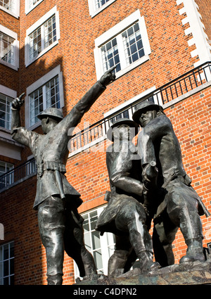 Three bronze statues national firefighters memorial by John W Mills near St Paul's Cathedral City of London England Europe Stock Photo