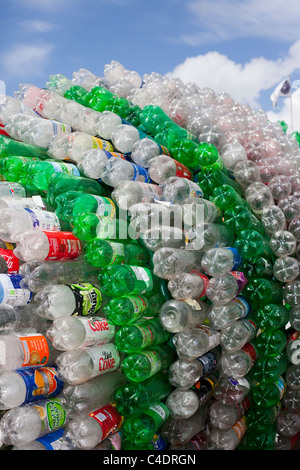 Recycling green plastic bottle to be reused for manufacturing. New life ...