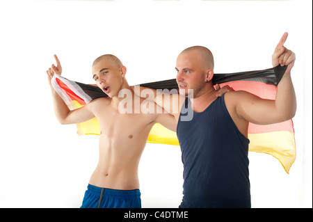 German skinhead hooligans cheering with Germany flag Stock Photo