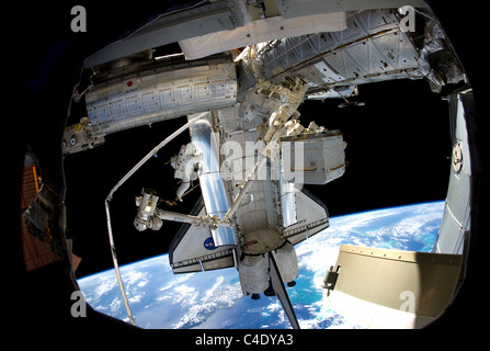NASA astronaut Steve Bowen carries out maintenance on the International Space Station Stock Photo
