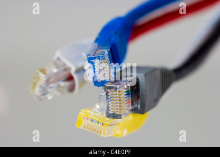 Four RJ-45 Ethernet connectors on white background Stock Photo