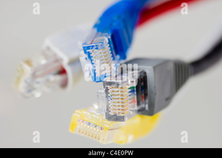 Four RJ-45 Ethernet connectors on white background Stock Photo