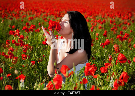 beaufiful woman on the poppy field Stock Photo