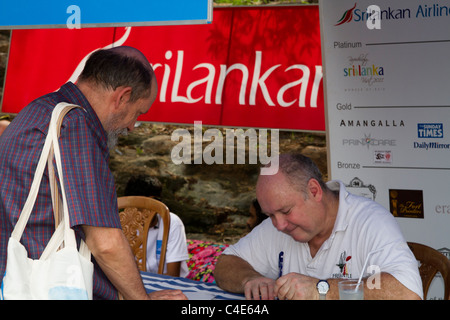 Louis de Bernières author of Captain Corelli's Mandolin signs autographs at the Galle Literary Festival, Sri Lanka. Stock Photo