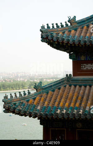 View of Chinese roof top /eaves / eave & Beijing city from Tower of Buddhist Incense; Longevity Hill, Summer Palace, China. Stock Photo