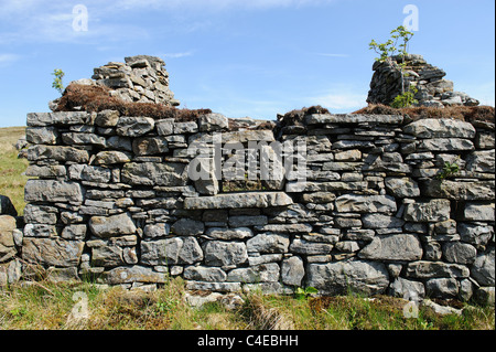 Roofless old stone mountain cottage Stock Photo