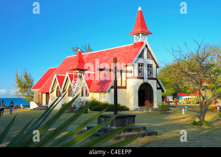 The landmark of Cap Malheureux is the famous church with a red roof. Cap Malheureux, Riviere du Rempart, Mauritius. Stock Photo
