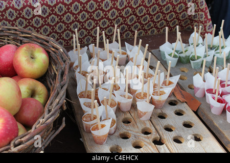 Homemade lollipops and apples. Stock Photo