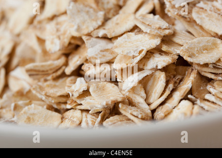 Dry oatmeal against a white background Stock Photo
