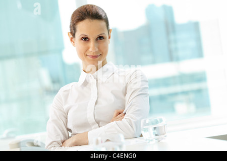 Photo of pretty businesswoman looking at camera Stock Photo