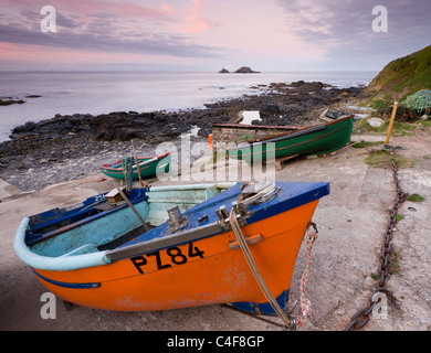 Fishing boats pulled high up the slipway at Priest's Cove, Cape Cornwall near St Just, Cornwall, England. Autumn (October) 2009. Stock Photo