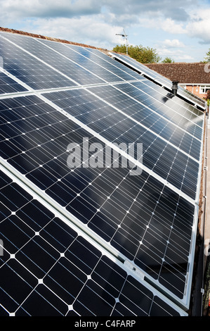 Solar panels on a suburban bungalow Stock Photo