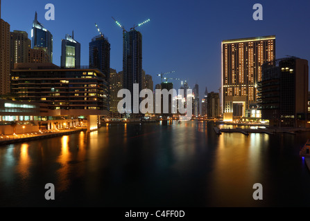 Highrise buildings at Dubai Marina illuminated at night Stock Photo