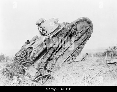 Tank in action passing a trench and starting toward the German line, during World War I, France Stock Photo