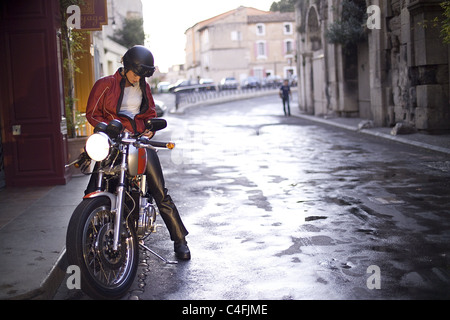woman sitting on a motorcycle Stock Photo