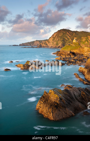 St Nicholas Chapel and Beacon Point on the rocky coast of Ilfracombe, Devon, England. Spring (May) 2011. Stock Photo