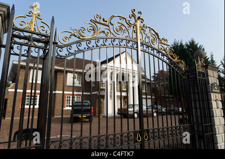 Large house behind metal gates on Bishops Avenue, London, UK Stock Photo