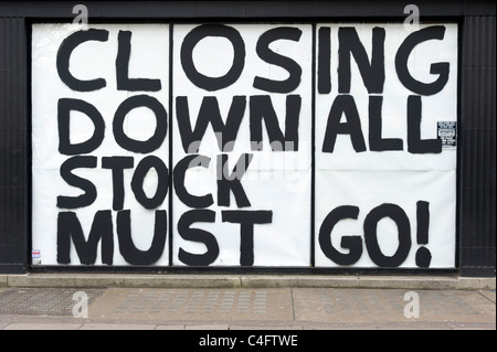 Closing down sale all stock must go sign on shop which has gone out of business, London, UK Stock Photo