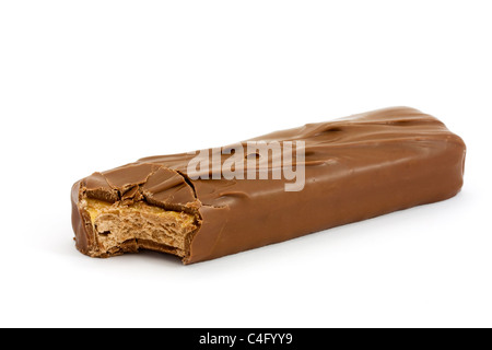 Chocolate covered caramel and nougat bar isolated on white with a missing bite Stock Photo