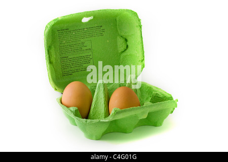 Two eggs in a green egg carton over white Stock Photo