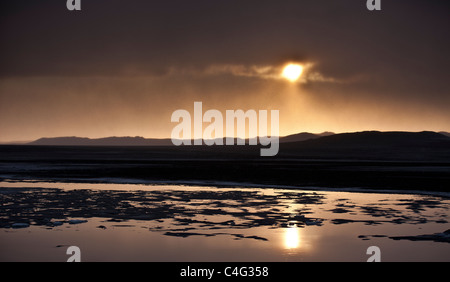 Sunset over glacial landscape, ash filled from the Grimsvotn volcanic eruption, Iceland Stock Photo