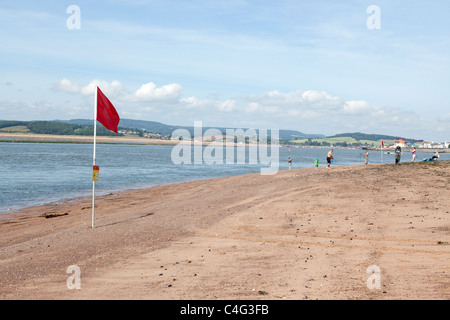 swimming warning notices flag on beach near exmouth devon uk Stock Photo