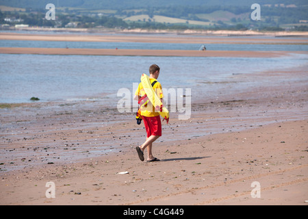 RNLI lifeguard on beach near Exmouth Devon UK Stock Photo