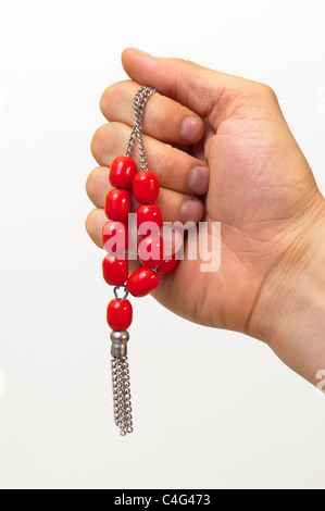 Hand holding a red komboloi Stock Photo
