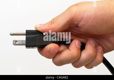 Hand holding an electrical cord Stock Photo