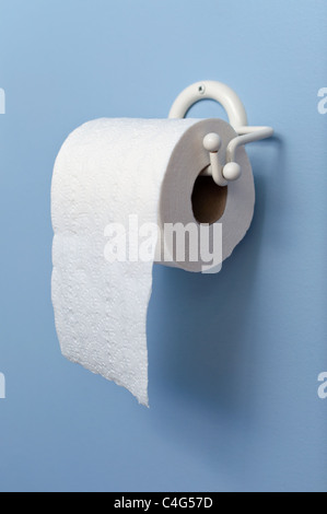 Toilet paper on holder Stock Photo