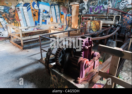 Old machinery in an abandoned building. Stock Photo