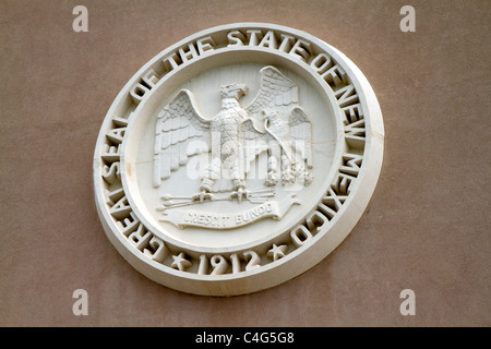 Stone carving of the State Seal on the New Mexico State Capitol building located in Santa Fe, New Mexico, USA. Stock Photo