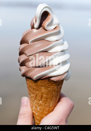 chocolate flavor ice cream cone close up on a white background Stock ...