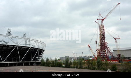 The 2012 Olympic Stadium completed ahead of schedule and  Anish Kapoor's sculpture, Arcelor Mittal Orbit, under construction.