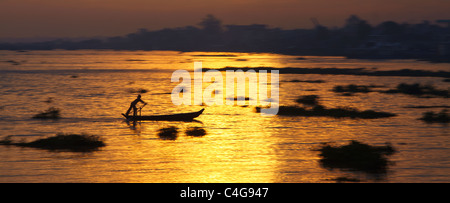 a boat laden on the river nr Cau Doc at dawn, Mekong Delta, Vietnam Stock Photo