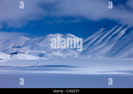 Castelluccio & the Piano Grande in winter, Monti Sibillini National Park, Umbria, Italy Stock Photo