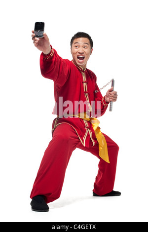 Man In Traditional Chinese Clothing doing Martial Arts Stock Photo