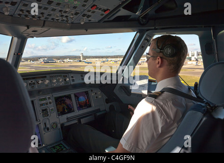 Pilot at controls of an Airbus A320 passenger aircraft Stock Photo