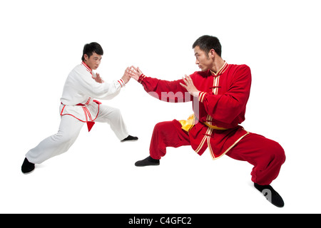 Focused Men Doing Martial Arts in Chinese Clothing Stock Photo
