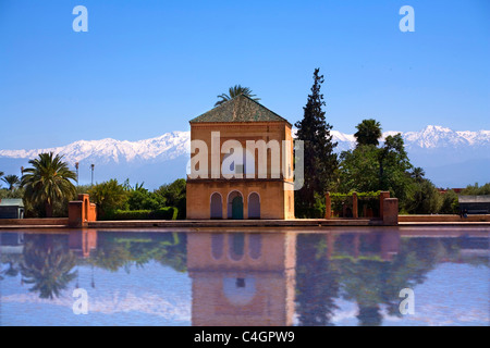 The beautiful La Menara Gardens in Marrakech , with the Atlas mountains capped with snow in the distance. Stock Photo